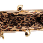 Kisslock shoulder bag interior with leopard-print lining and gold top frame clasp