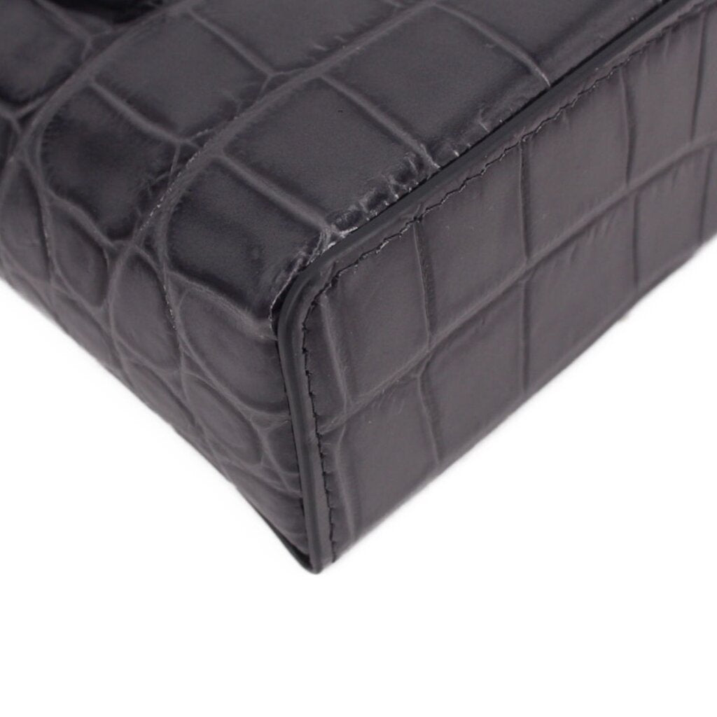CHANEL vanity crossbody bag corner detail, dark leather texture and stitched edge