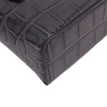 CHANEL vanity crossbody bag corner detail, dark leather texture and stitched edge