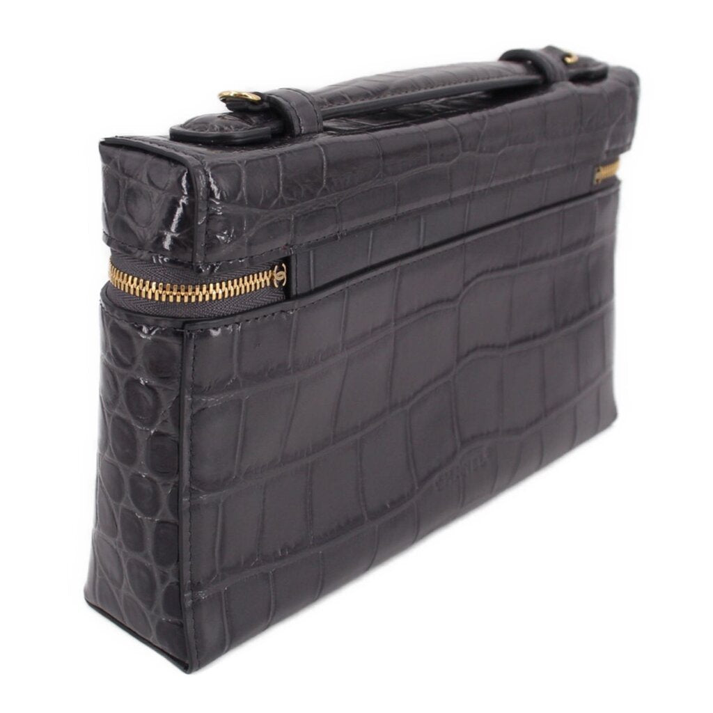 CHANEL vanity crossbody bag side view, dark leather with gold-tone zipper and hardware