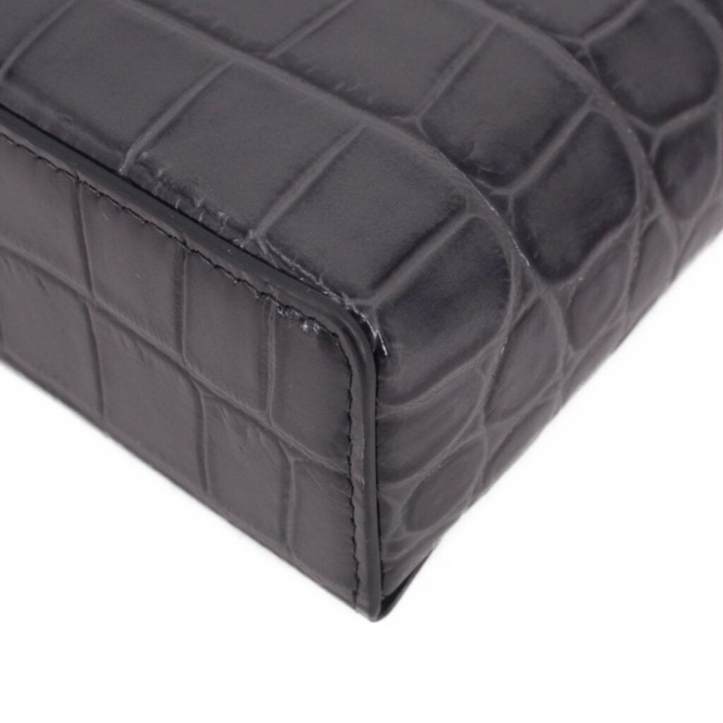 CHANEL vanity crossbody bag bottom corner detail with dark leather texture and seams