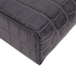 CHANEL vanity crossbody bag bottom corner detail with dark leather texture and seams