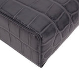 CHANEL vanity crossbody bag bottom corner detail with dark leather texture and seams