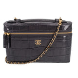 CHANEL vanity crossbody bag in dark textured leather with gold-tone chain and logo