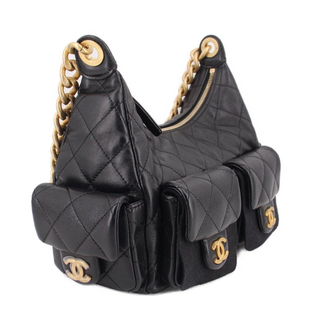 Black quilted hobo bag with side pocket flaps, gold-tone chain, and CHANEL logo