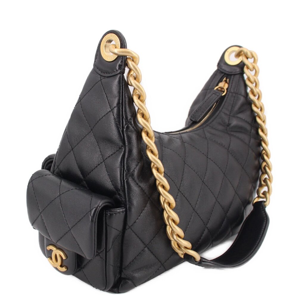 Black quilted hobo bag with gold-tone chain handle and side pocket flap