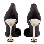 Black satin heels in back view with slim stiletto heel and metal-look heel cap