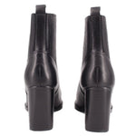 Black heeled ankle boots with elastic gores and back pull tabs.