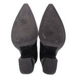 Black heeled booties outsole view with pointed toe and thick heel block base