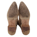 Tall snake-print boots underside view with heel and size label on insole