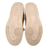 Tan suede sneaker outsoles with textured tread