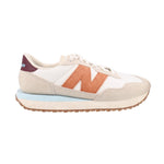 Suede sneaker pair, beige with orange geometric panels and white lace-up front