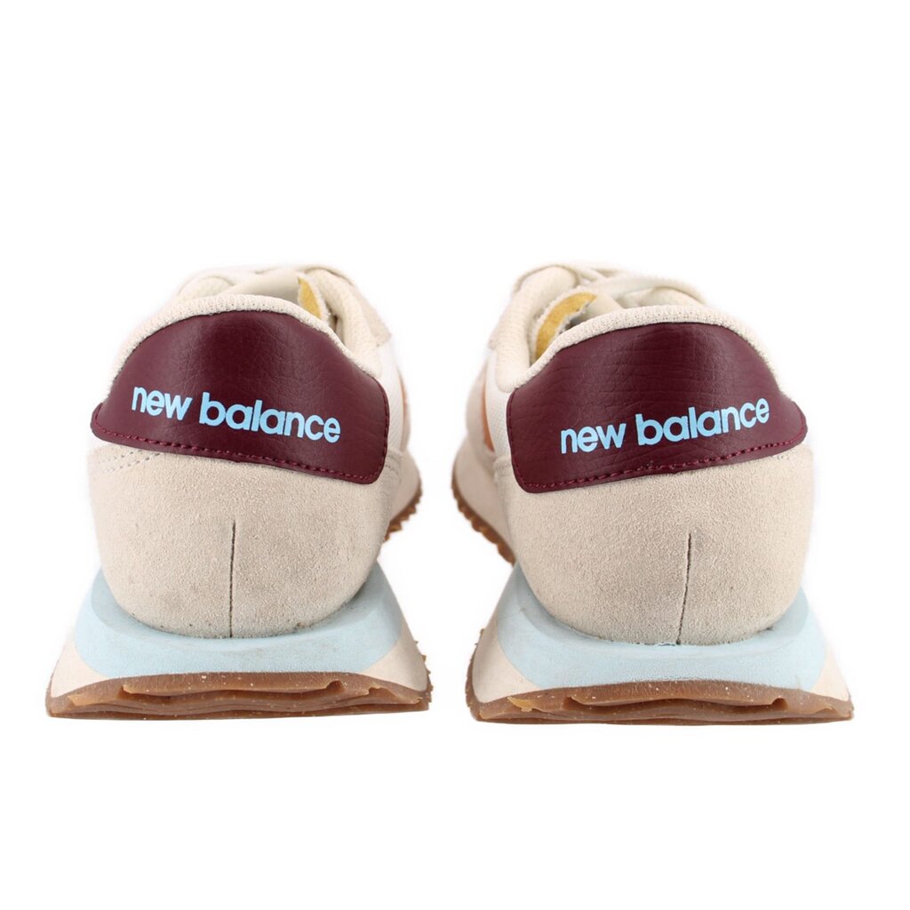 Back view suede sneakers in beige with new balance logo on burgundy heel