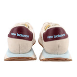 Back view suede sneakers in beige with new balance logo on burgundy heel