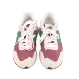 Pair of lace-up sneakers with maroon, green, and cream color-block uppers