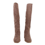 Brown suede knee-high heeled boots shown from front angle with block heel
