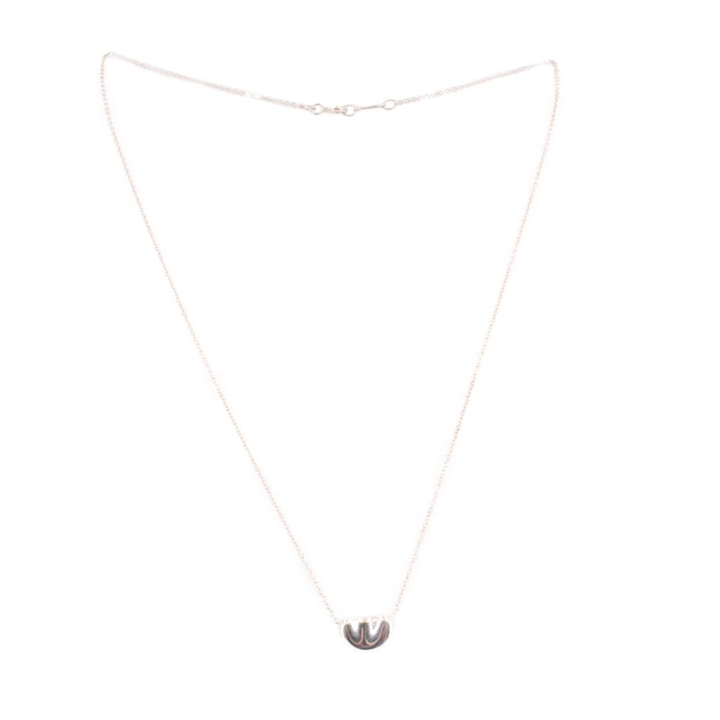 Sterling silver bean pendant necklace with small three-lobed bead charm