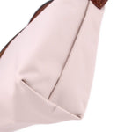 Beige fabric pouch close-up with inner seam and textured fabric