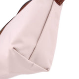Beige fabric pouch close-up with inner seam and textured fabric