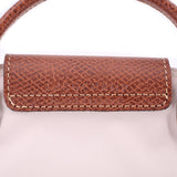 Brown leather front flap with textured finish and contrasting stitched edge