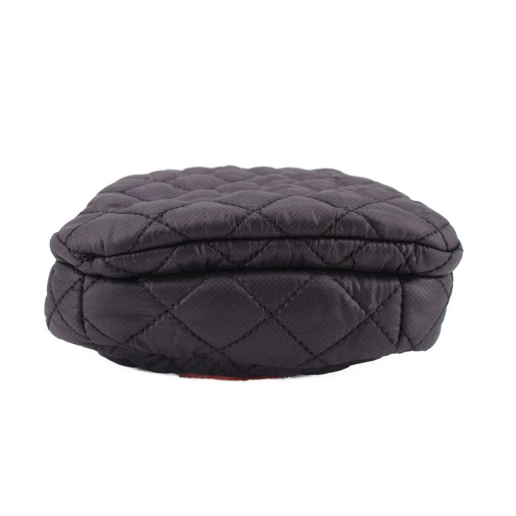 Quilted black phone crossbody bag with rounded flap top and stitched diamond pattern