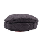 Quilted black phone crossbody bag with rounded flap top and stitched diamond pattern