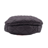Quilted black phone crossbody bag with rounded flap top and stitched diamond pattern