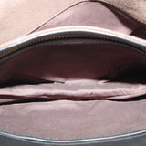 Black boxy crossbody bag open, showing fabric lining and interior seam details