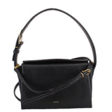 Black boxy crossbody bag with top flap and gold-tone hardware, short shoulder strap