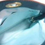 Teal leather wristlet pouch interior with fabric lining and metal ring detail