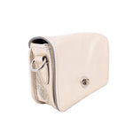 Coach Penny crossbody bag, metallic gold side view with turn-lock clasp and loop.