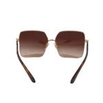 Square sunglasses with gold rims and brown gradient lenses, tortoise arms