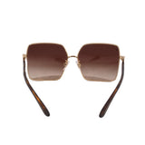 Square sunglasses with gold rims and brown gradient lenses, tortoise arms
