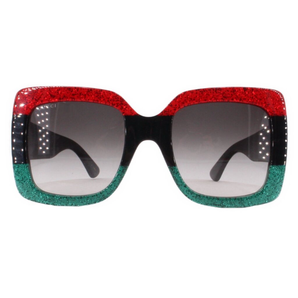 Oversized sunglasses with dark lenses and red-to-green glitter frame, black accents