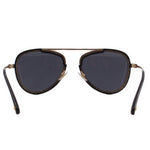 Black cat-eye sunglasses with dark lenses and gold-tone rim detailing