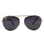 Black cat-eye sunglasses with dark lenses and gold-tone metal accents