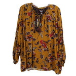 Yellow floral blouse with tassel tie neckline, long puff sleeves, flowing fit
