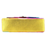 Yellow textured crossbody bag with purple trim and visible zipper edge