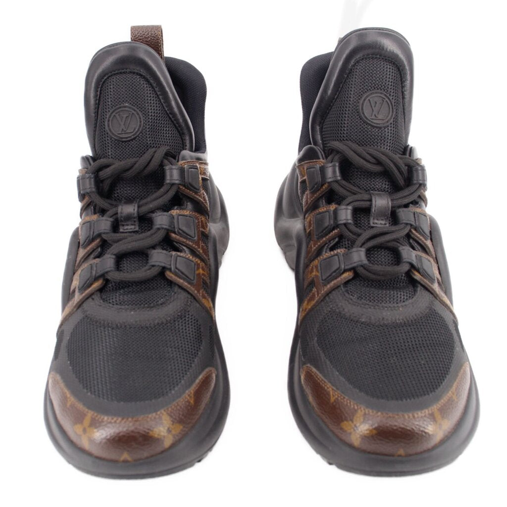 Black monogram lace-up sneakers, front view with brown patterned toe and mesh sides