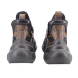 Back view of black monogram sneakers with high collar and heel pull tab