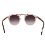 Blush pink cat-eye sunglasses with dark tinted lenses and gold-tone accents