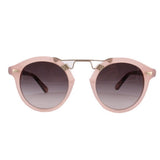Blush pink cat-eye sunglasses with dark tinted lenses and gold-tone details