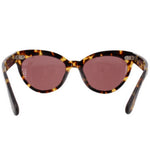 Tortoise cat-eye sunglasses with dark pink lenses and jeweled details