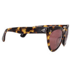 Tortoise cat-eye sunglasses, side view with dark pink lenses