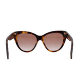Tortoise sunglasses with tinted pink lenses and dark temples