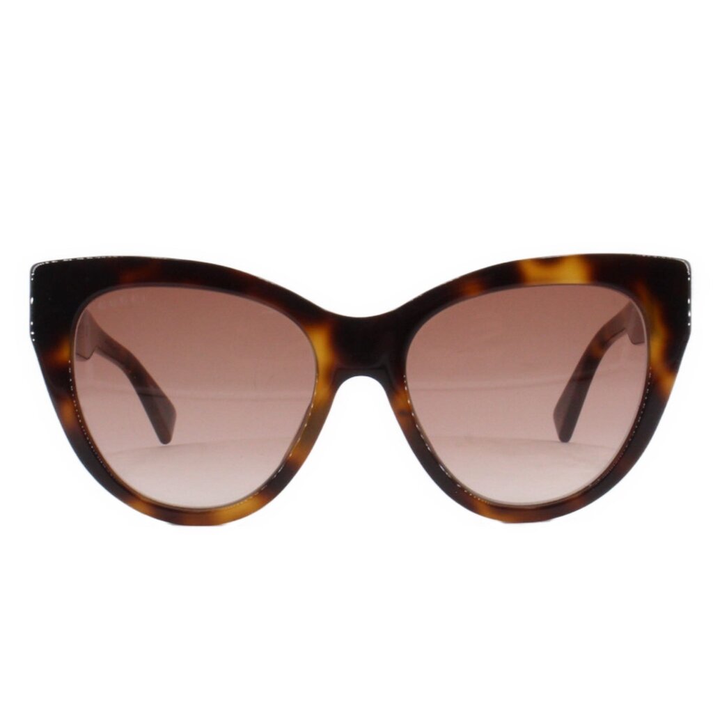 Tortoise cat-eye sunglasses with tinted pink lenses and curved dark frame
