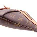 Close-up of monogram belt bag strap edge and top zip trim