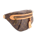 Monogram belt bag with top zip, tan trim, and side charm detail