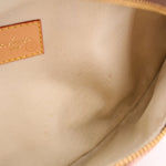 Interior view of monogram belt bag lining with stitched leather label