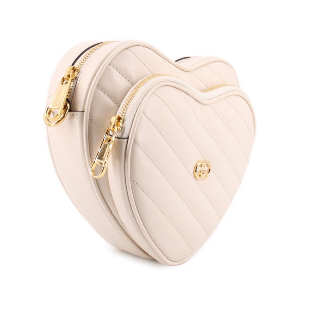 GUCCI cream heart crossbody bag side view with zipper trim and gold hardware